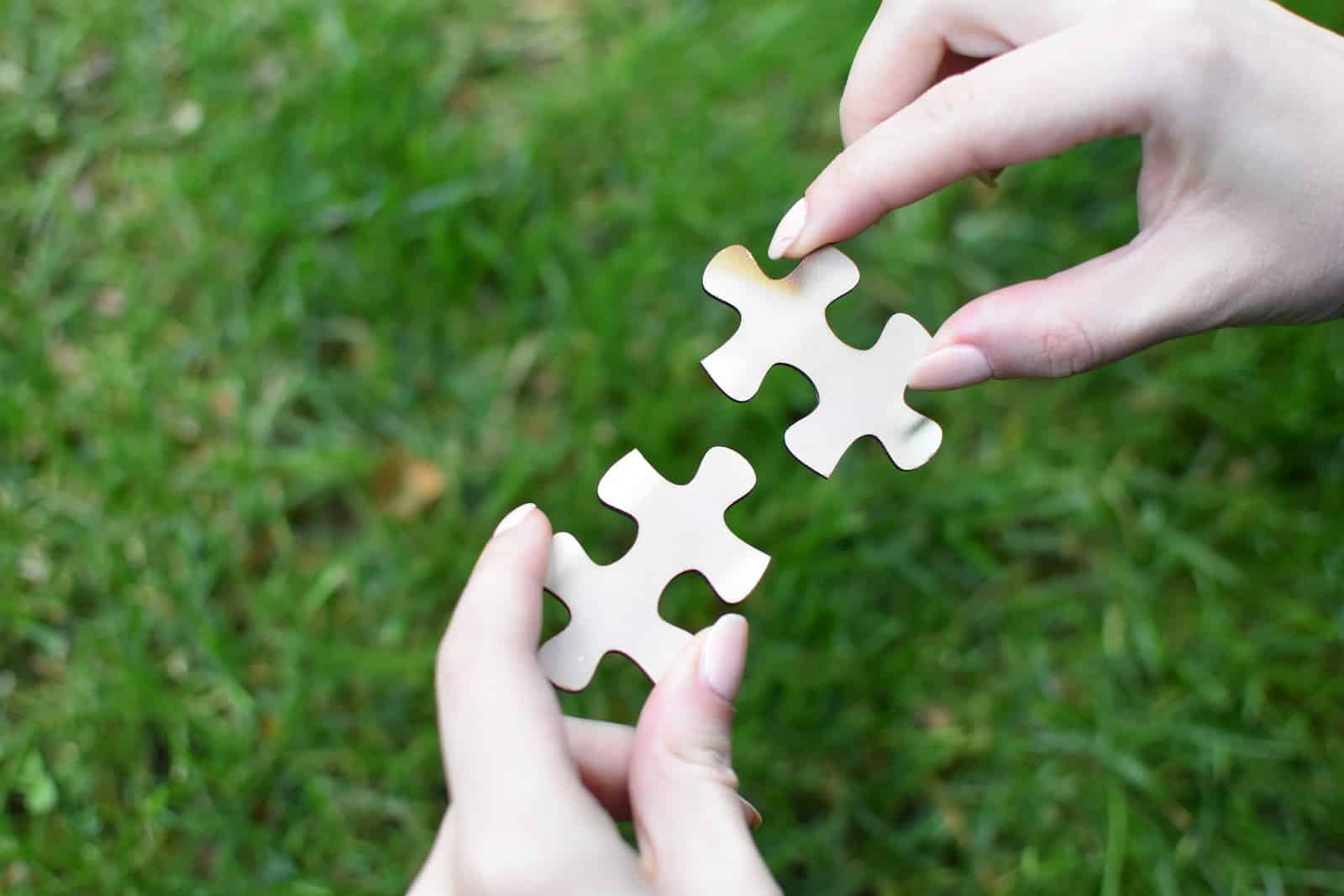 Mastering communication: how to connect with anyone 21 A person holding a piece of a puzzle in their hands-how to connect with anyone